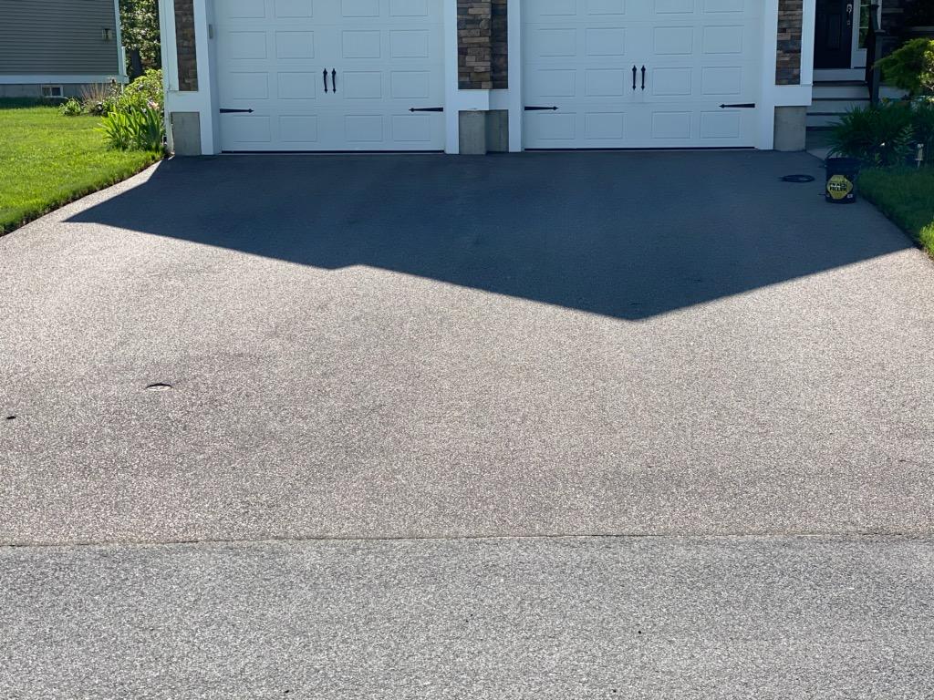 The same driveway after the seal-coating has dried.